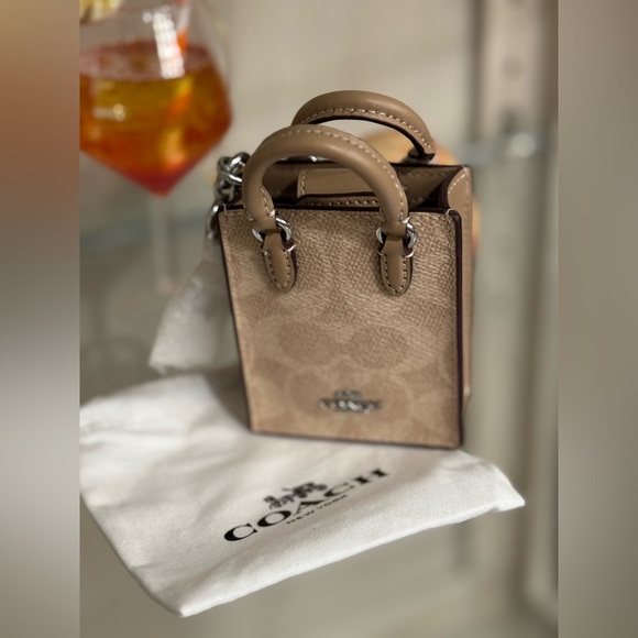 Coach Handbags - Coach Tan Mini Bag